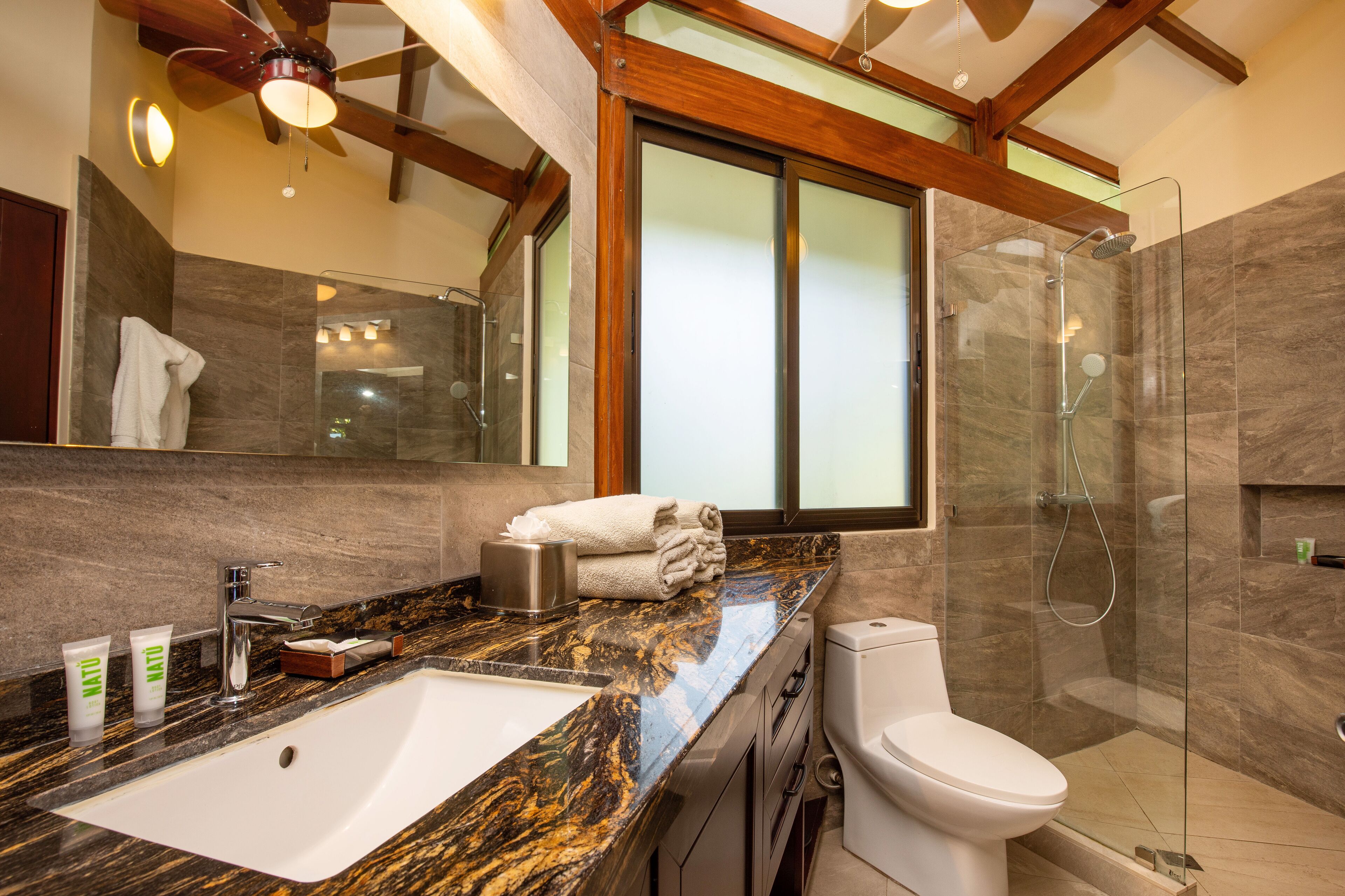 premium bungalow | bathroom | shower, free toiletries, towels, toilet paper