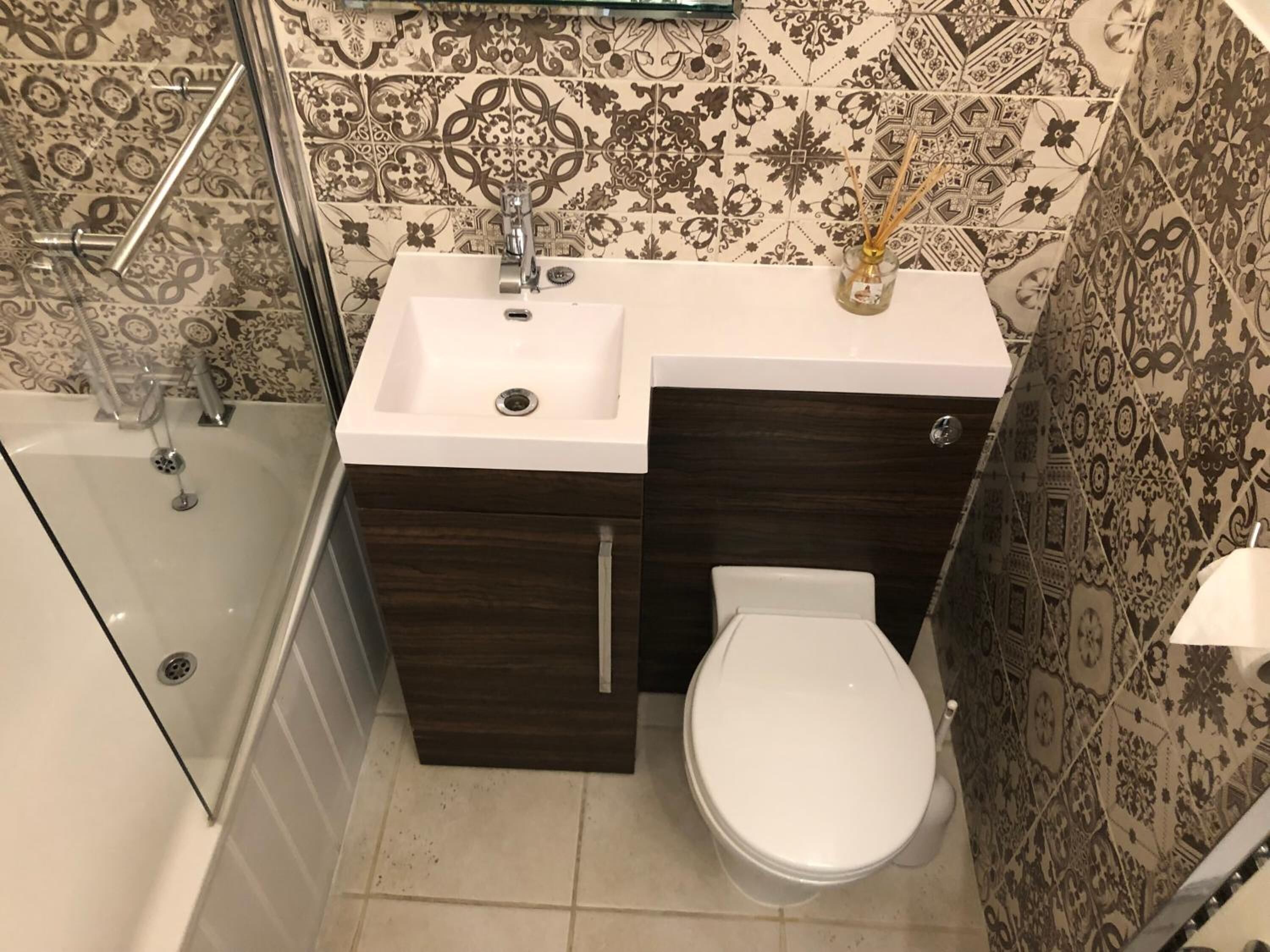 designer toiletries, hair dryer, towels