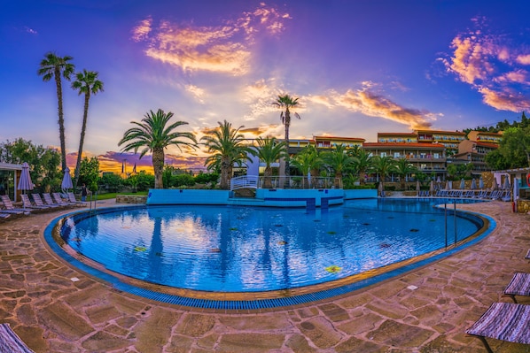 Outdoor pool, open 10 AM to 7 PM, pool umbrellas, pool loungers