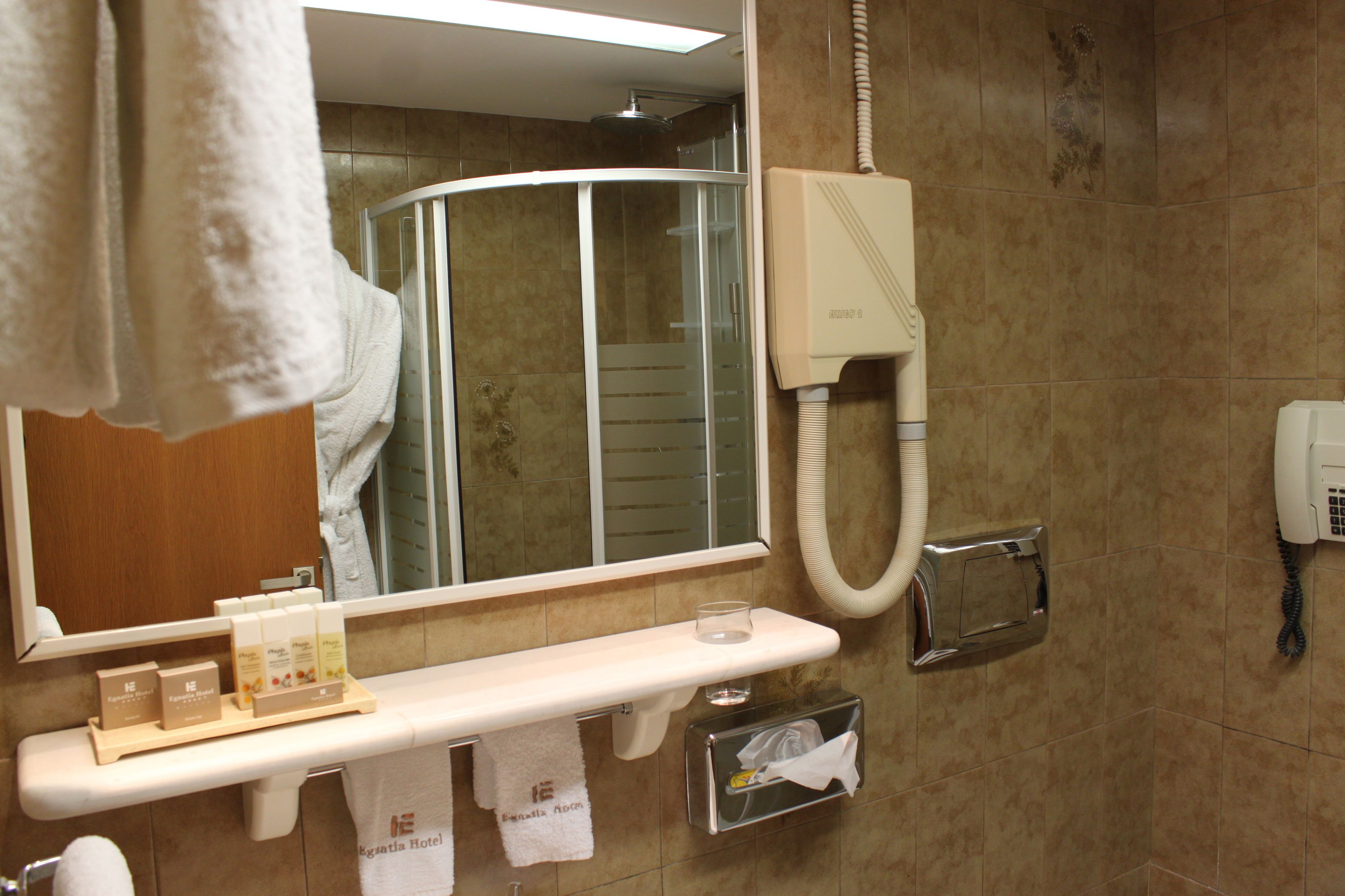 economy double or twin room | bathroom | designer toiletries, hair dryer, slippers, towels