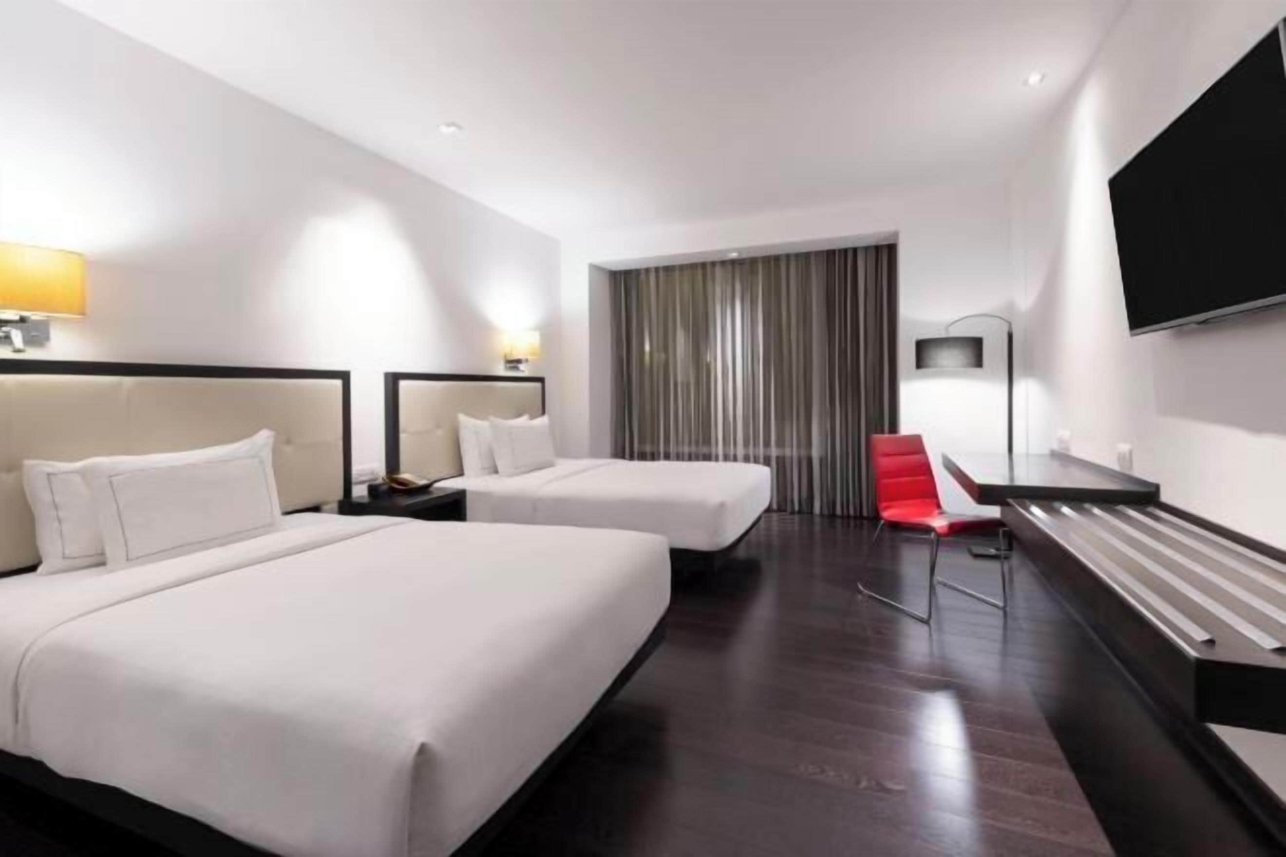 Premium bedding, down comforters, pillowtop beds, minibar