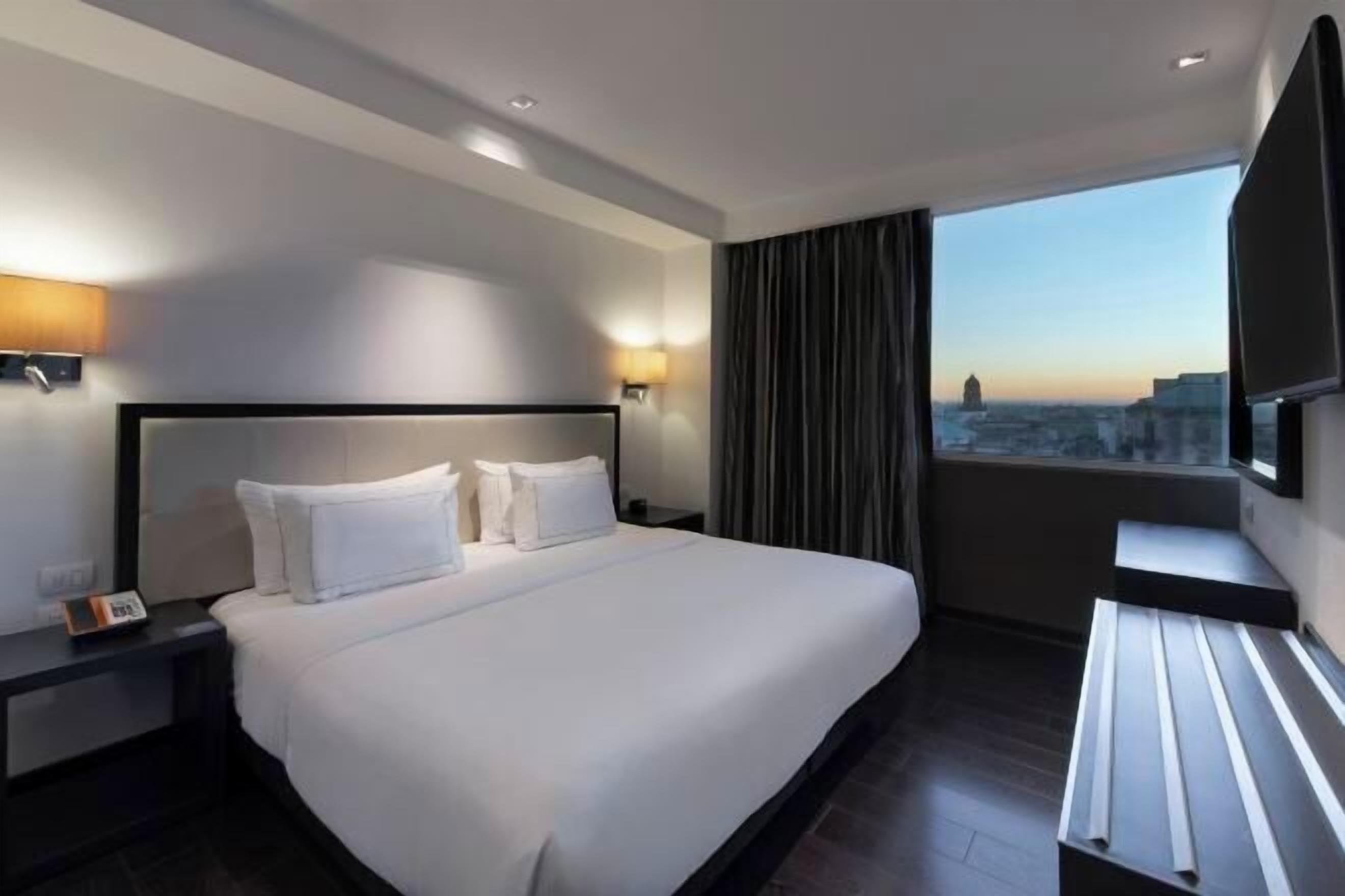 Premium bedding, down comforters, pillowtop beds, minibar