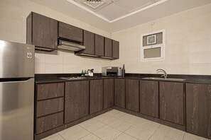 Two Bedroom Family Suite with kitchen | Private kitchen | Microwave, coffee/tea maker, electric kettle, cleaning supplies
