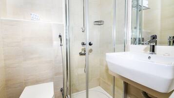Shower, free toiletries, hair dryer, slippers