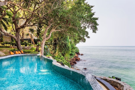 Outdoor pool, pool umbrellas, pool loungers. The Monttra Pattaya