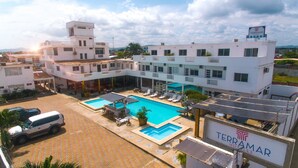 A hotel with a swimming pool, multiple balconies, and a sign for 'Terramar Hotel'. - Terramar Hoteles  (Crucita)