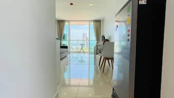 Deluxe One Bedroom Apartment | Living area | Flat-screen TV