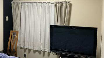 Down duvets, desk, laptop workspace, blackout curtains