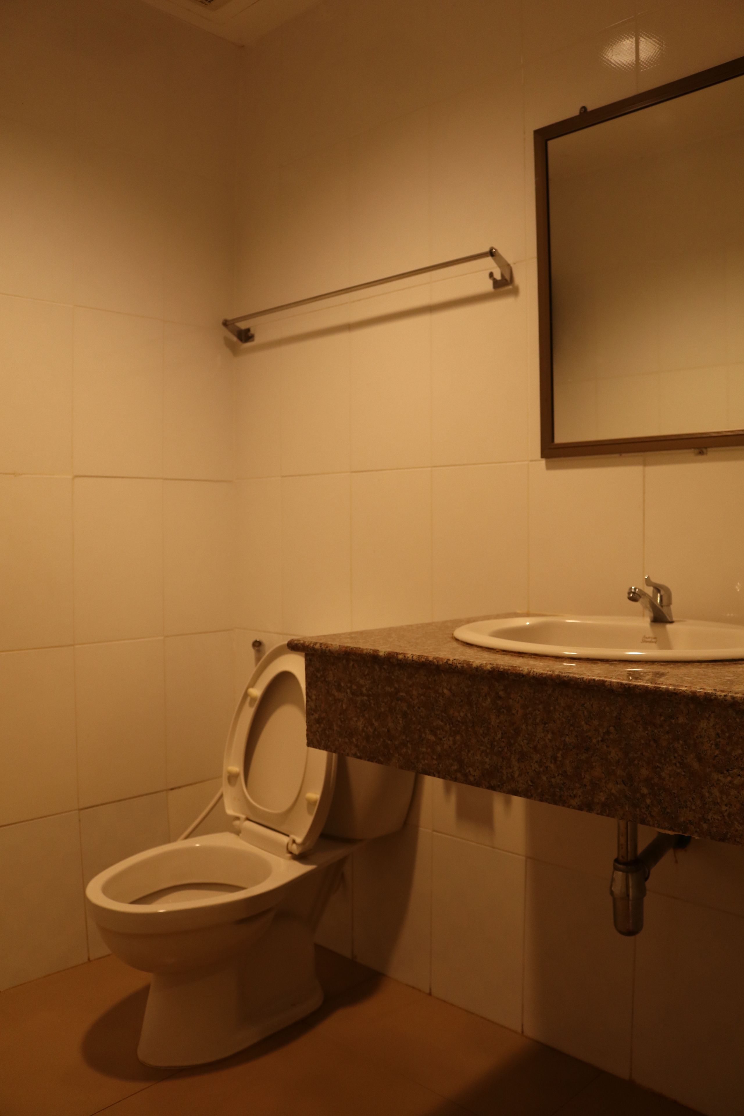 standard twin bed | bathroom | free toiletries, towels