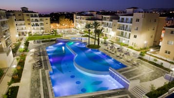 Indoor pool, pool umbrellas, pool loungers