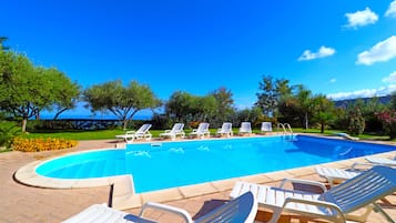 Seasonal outdoor pool, a rooftop pool, pool umbrellas, pool loungers