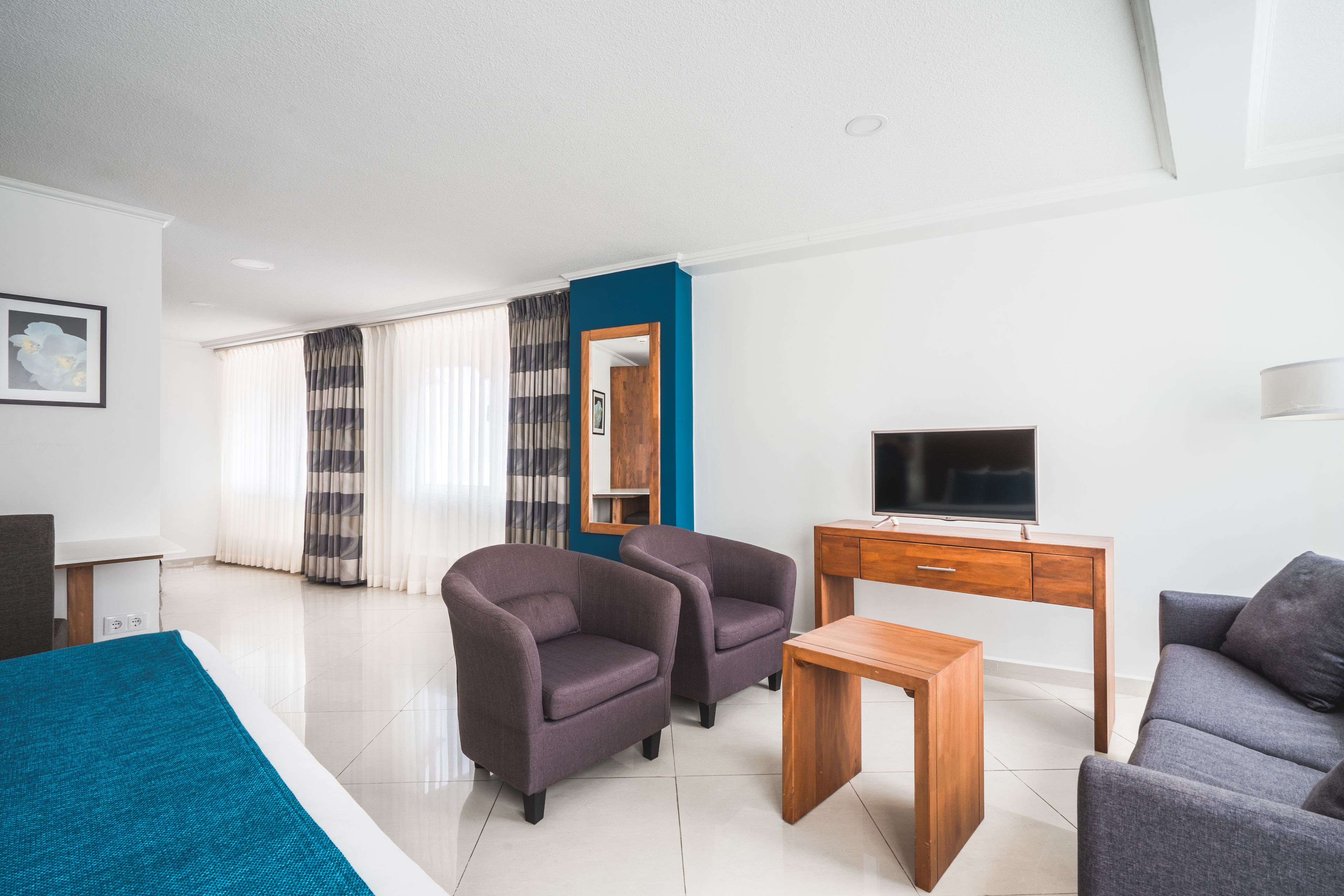 junior suite, 1 king bed with sofa bed, kitchenette | 1 bedroom, in-room safe, desk, iron/ironing board