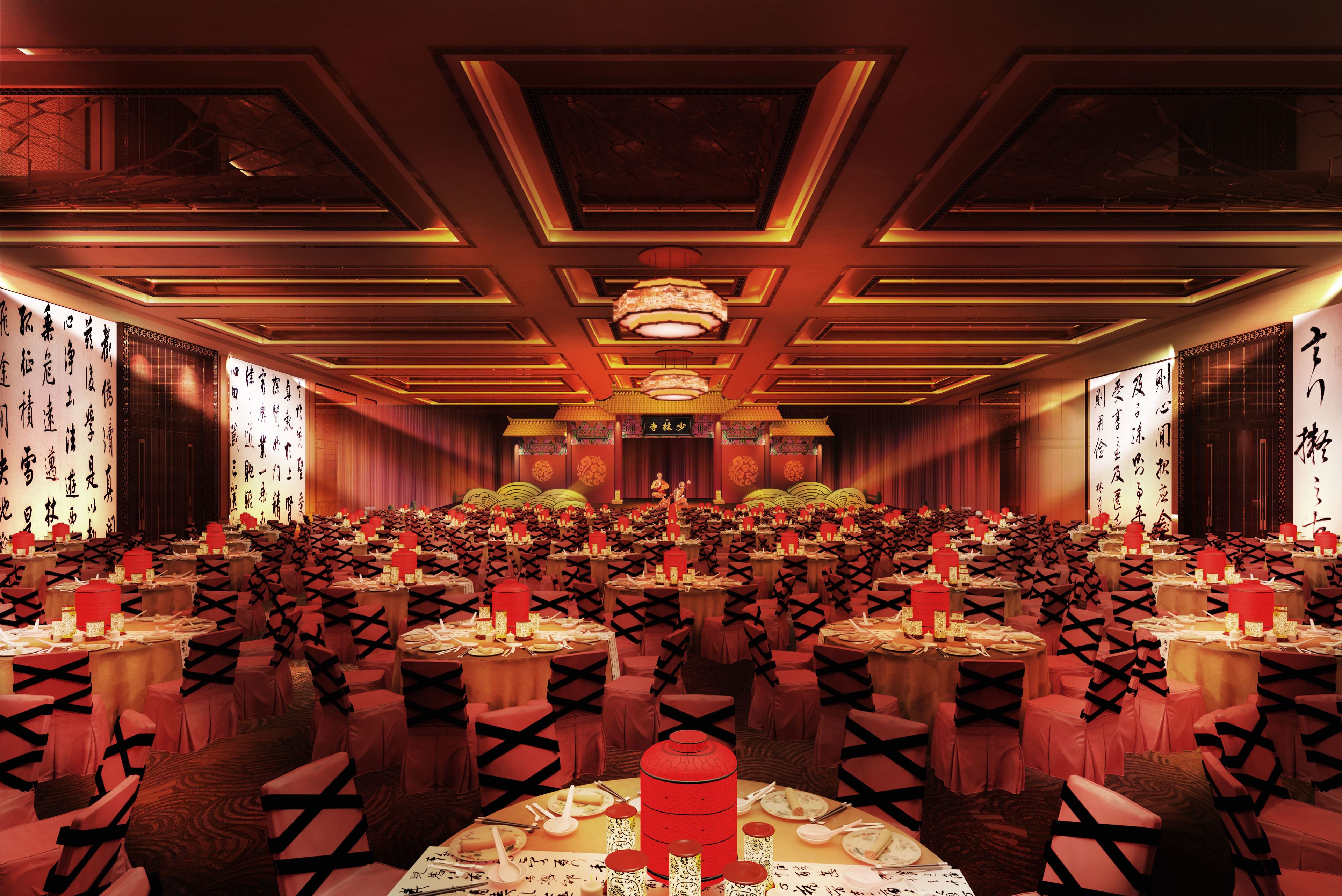 A banquet hall with rows of tables, each set with red tablecloths and black chair covers.