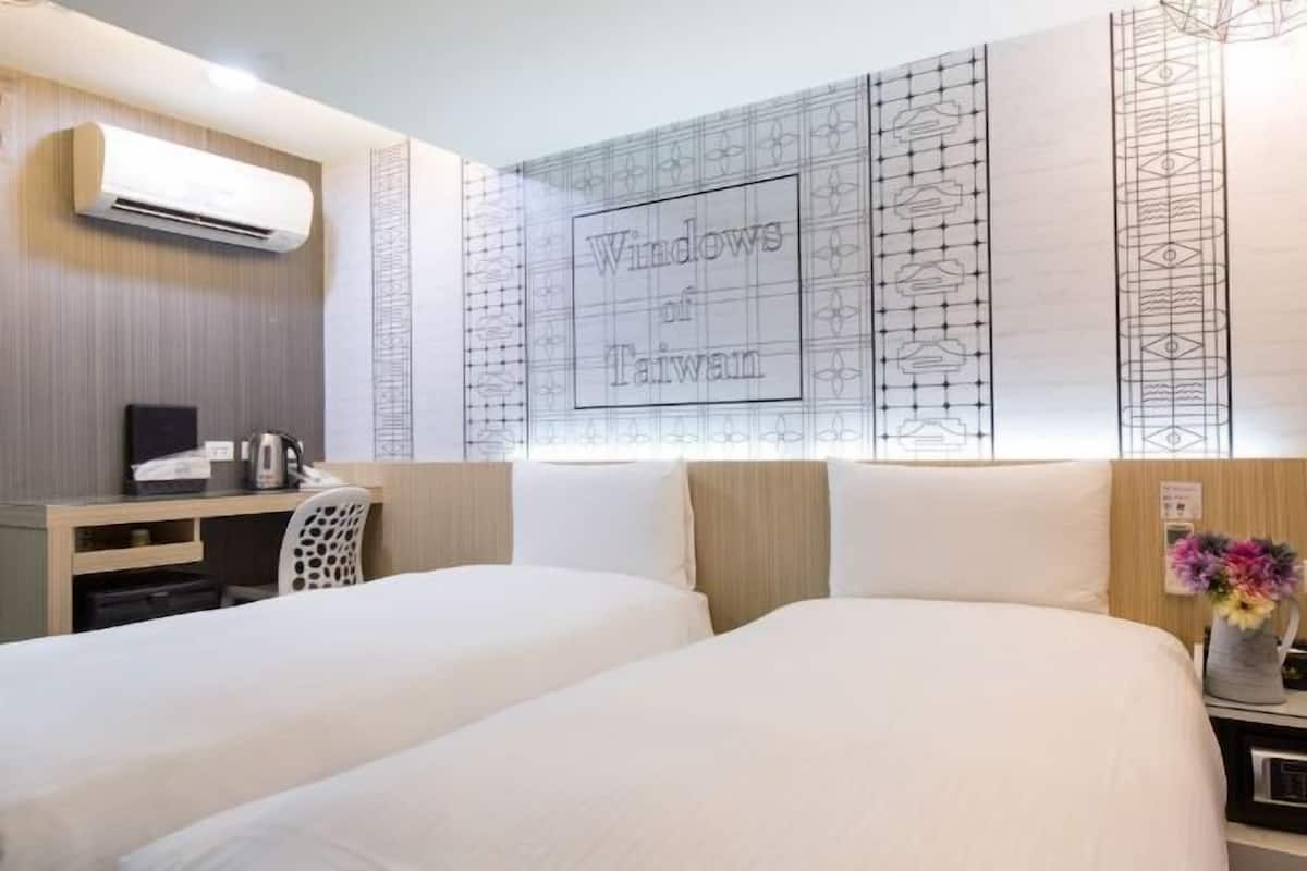 Luxe beddengoed, een kluis op de kamer, een bureau, gratis wifi