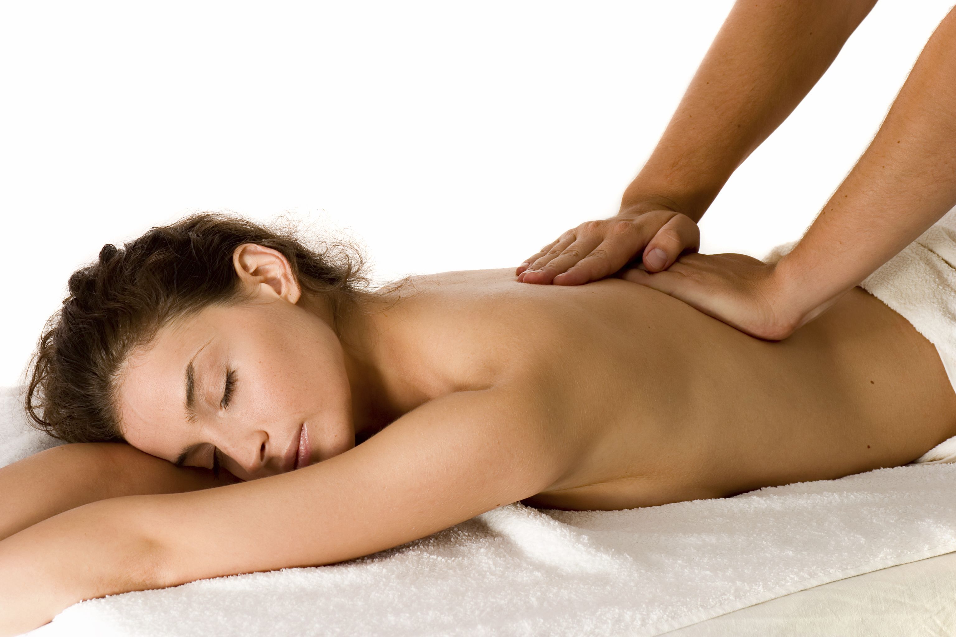 A person receiving a back massage on a white towel.