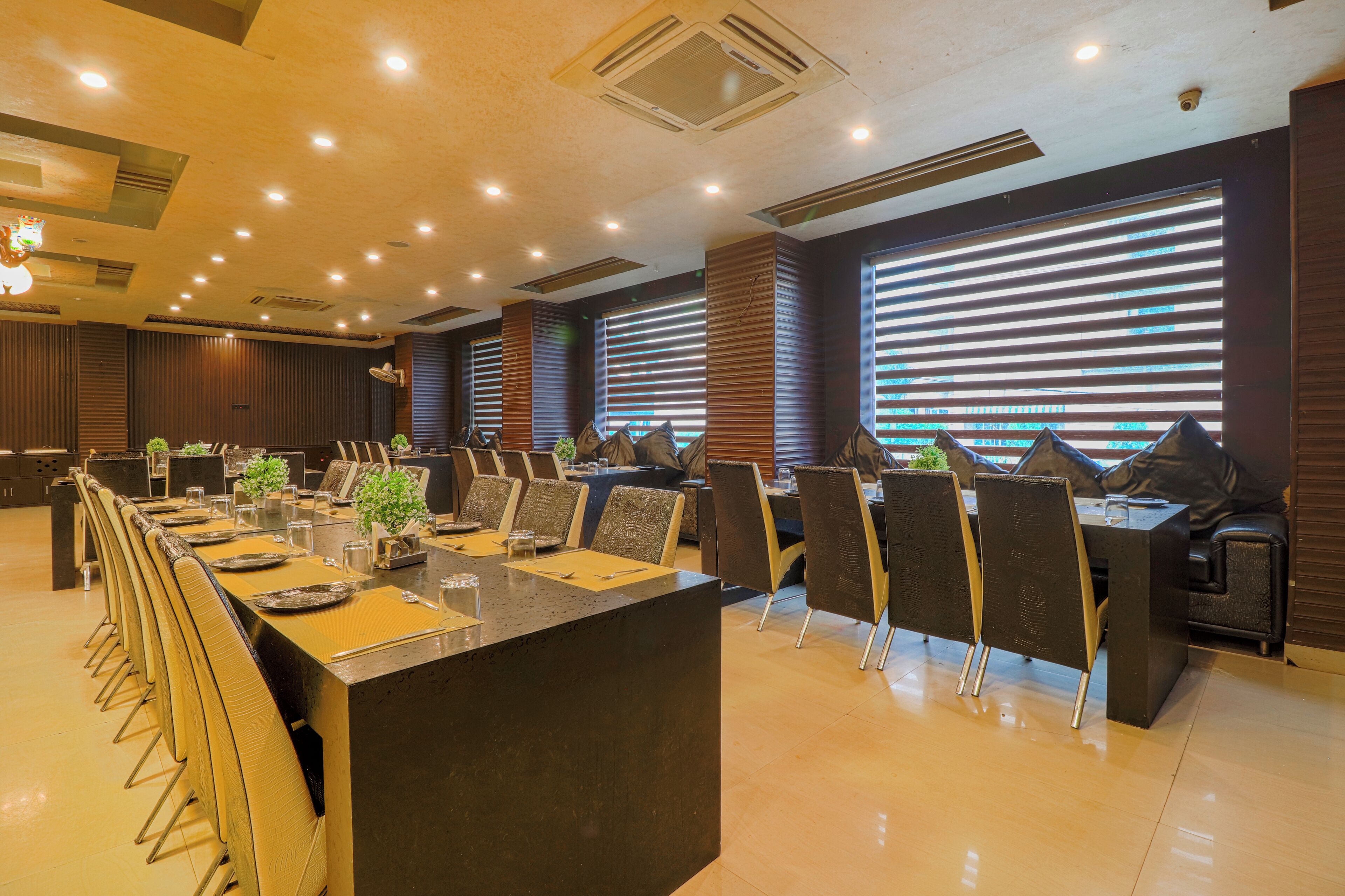 A conference room with a long table, chairs, and a modern design.