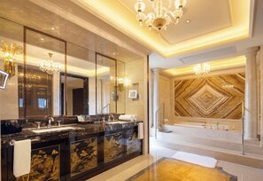 A luxurious bathroom with a large mirror, marble vanity, and a decorative wall. - Yuluxe Hotel Taizhou (Taizhou)