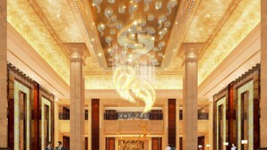A grand lobby with a central fountain, high ceilings, and ornate columns. - Yuluxe Hotel Taizhou (Taizhou)