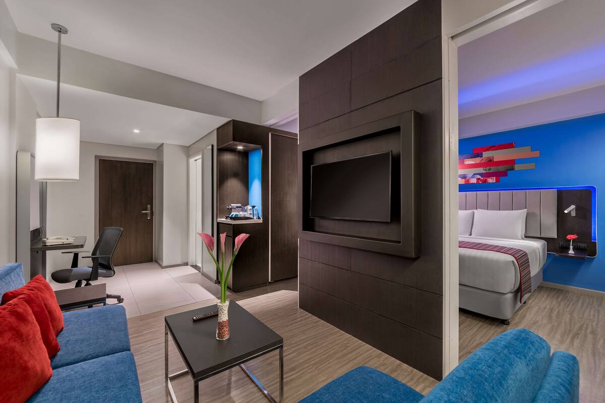 junior suite | in-room safe, desk, laptop workspace, blackout curtains