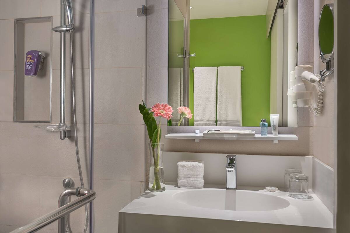 standard room | bathroom | shower, rainfall showerhead, eco-friendly toiletries, hair dryer