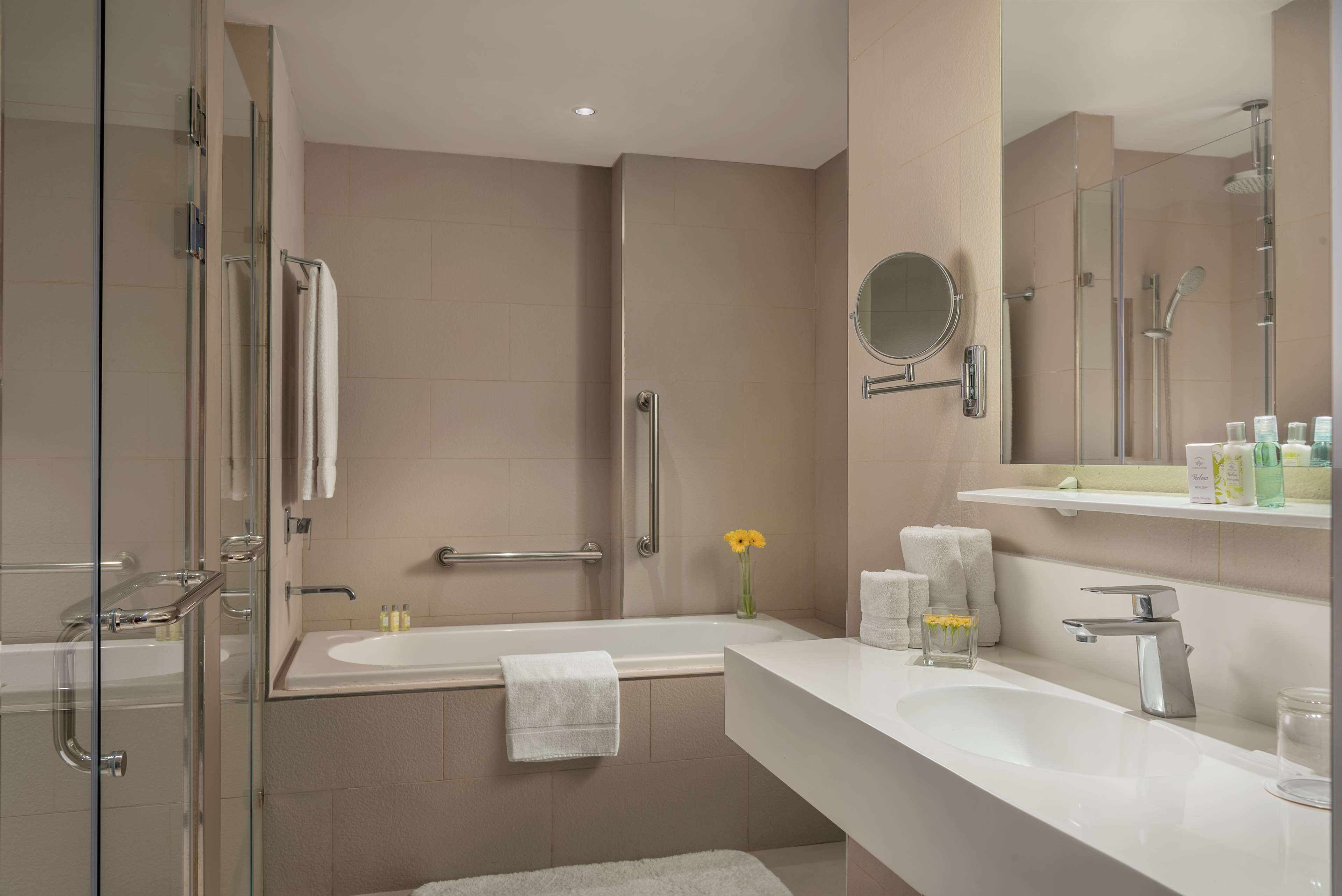 junior suite | bathroom | shower, rainfall showerhead, eco-friendly toiletries, hair dryer