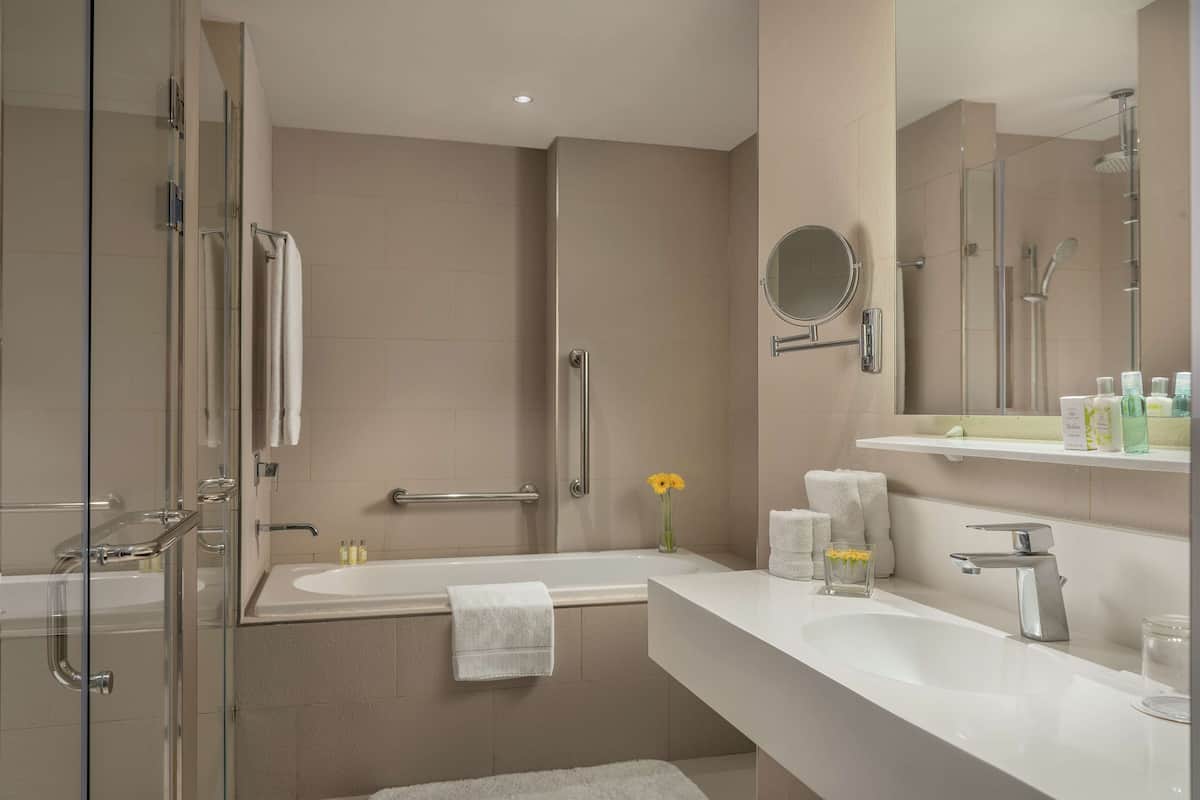 junior suite | bathroom | shower, rainfall showerhead, eco-friendly toiletries, hair dryer