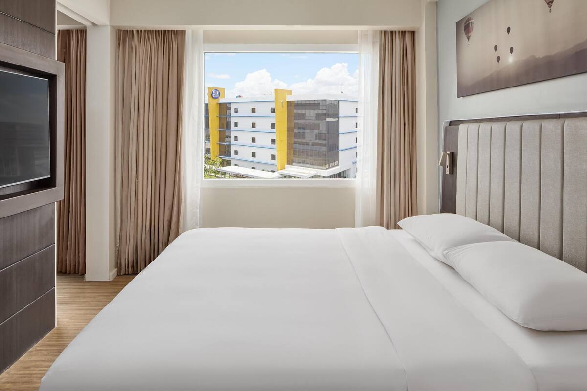 junior suite | in-room safe, desk, laptop workspace, blackout curtains