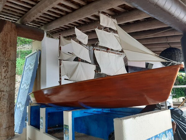 A model ship displayed indoors, possibly in a museum or exhibition space.
