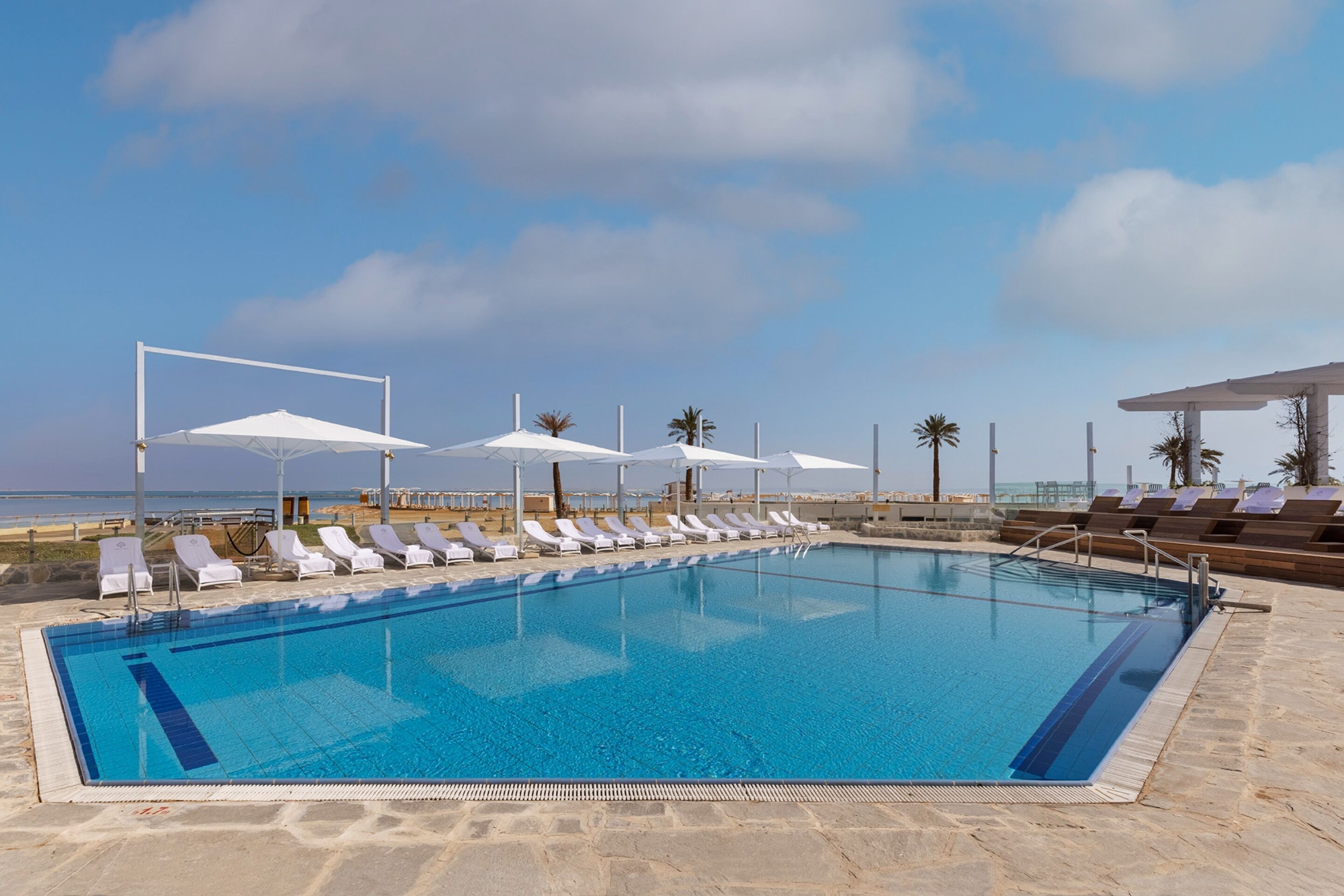 Indoor pool, outdoor pool, pool umbrellas, pool loungers