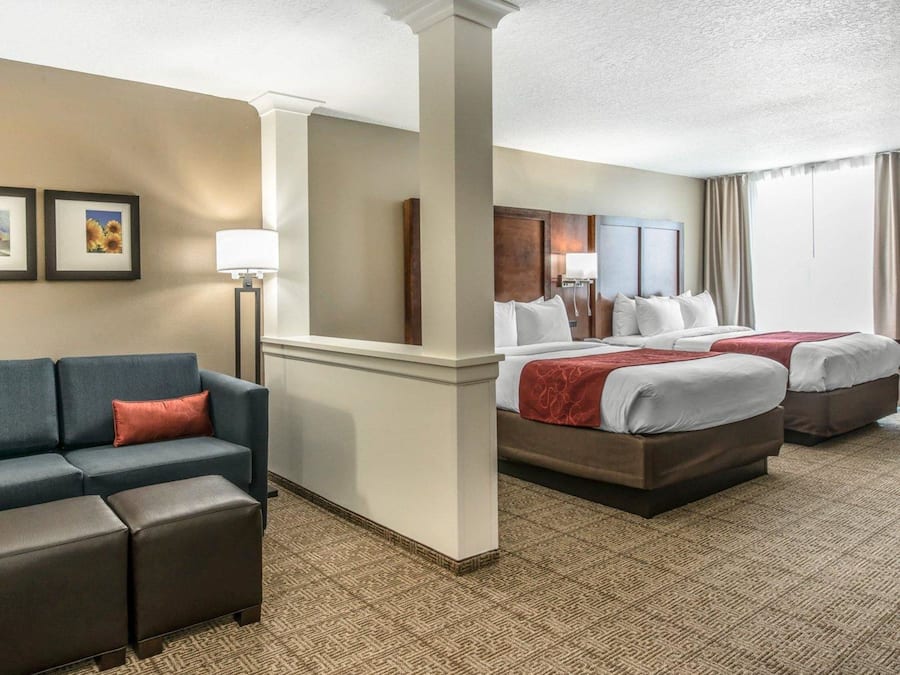 Suite, Multiple Beds, Non Smoking | Desk, laptop workspace, blackout drapes, iron/ironing board