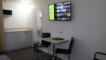 Desk, laptop workspace, blackout drapes, soundproofing