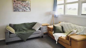 Comfort Bungalow | Living area | 40-inch flat-screen TV with digital channels, TV, DVD player