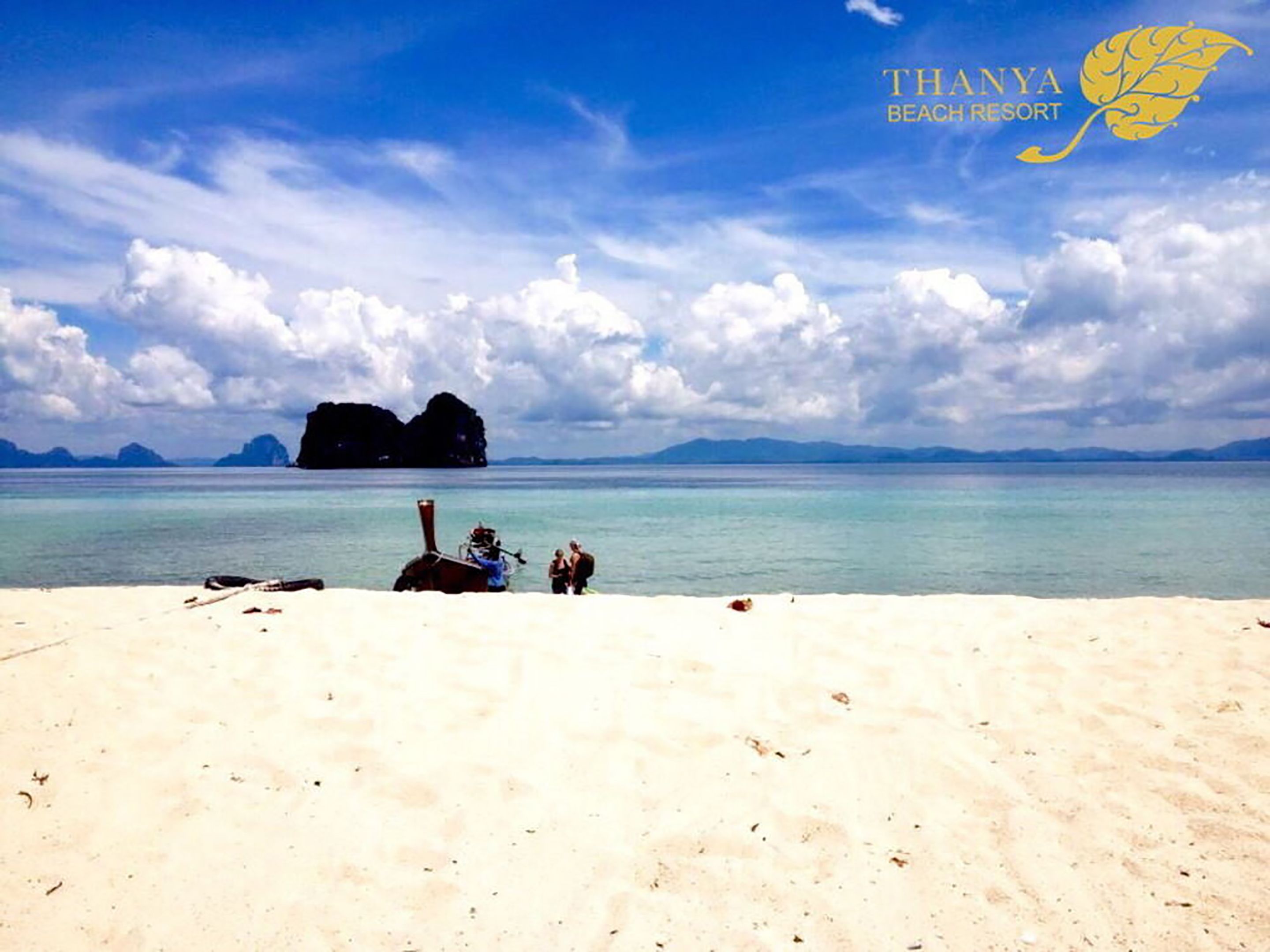 Beach nearby, white sand, beach umbrellas, beach towels