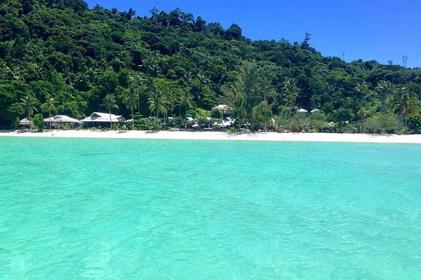 Beach nearby, white sand, beach umbrellas, beach towels