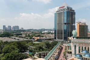 A high-rise building with a distinctive glass facade and a sign reading "SUNWAY". - W Studio Resort Suites at Pyramid Tower (Petaling Jaya)