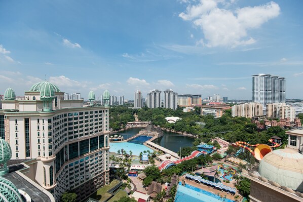 A high-rise hotel with a swimming pool and water park amenities. - W Studio Resort Suites at Pyramid Tower (Petaling Jaya)