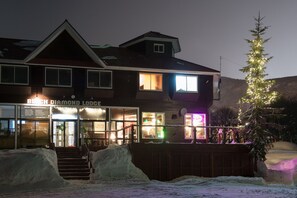 A two-story building with a sign reading "Beach Diamond Lodge." - Black Diamond Lodge (Niseko)