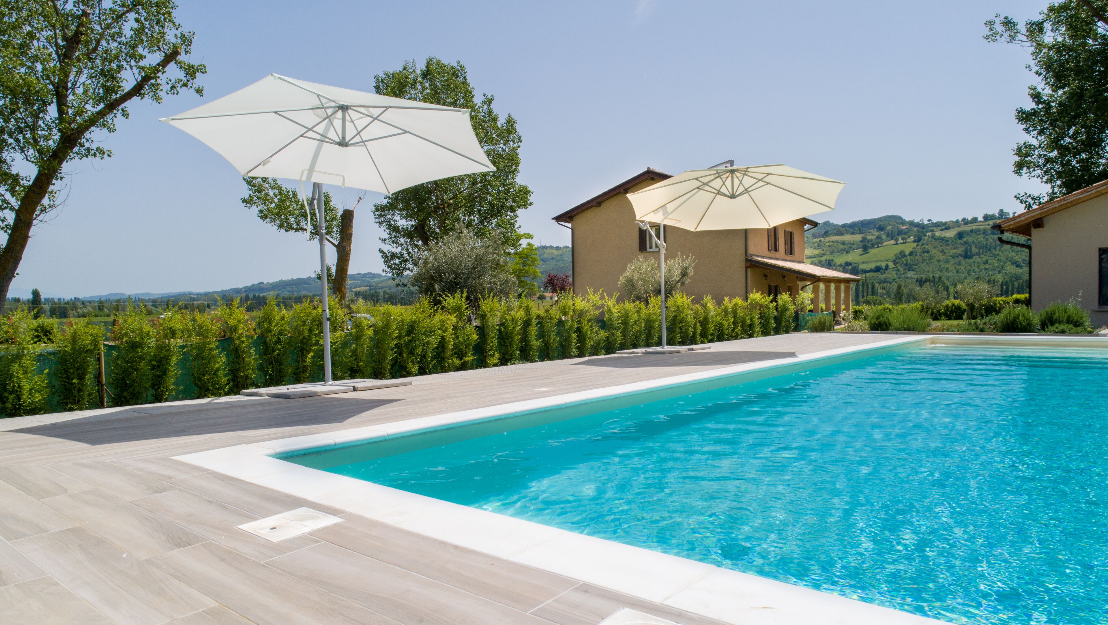 Seasonal outdoor pool, pool umbrellas