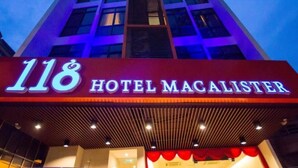 The exterior of Hotel MacAllister with a prominent '118' sign and a modern facade. - 118 Hotel Macalister (George Town)