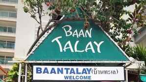 A building entrance with a sign reading "BAANTALAY WELCOME". - Baan Talay (Pattaya)