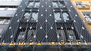 A hotel facade with a geometric metal mesh design and the name 'LAMPA HOTEL' illuminated in neon lights. - Lampa Design Hotel - Special Class (Istanbul)