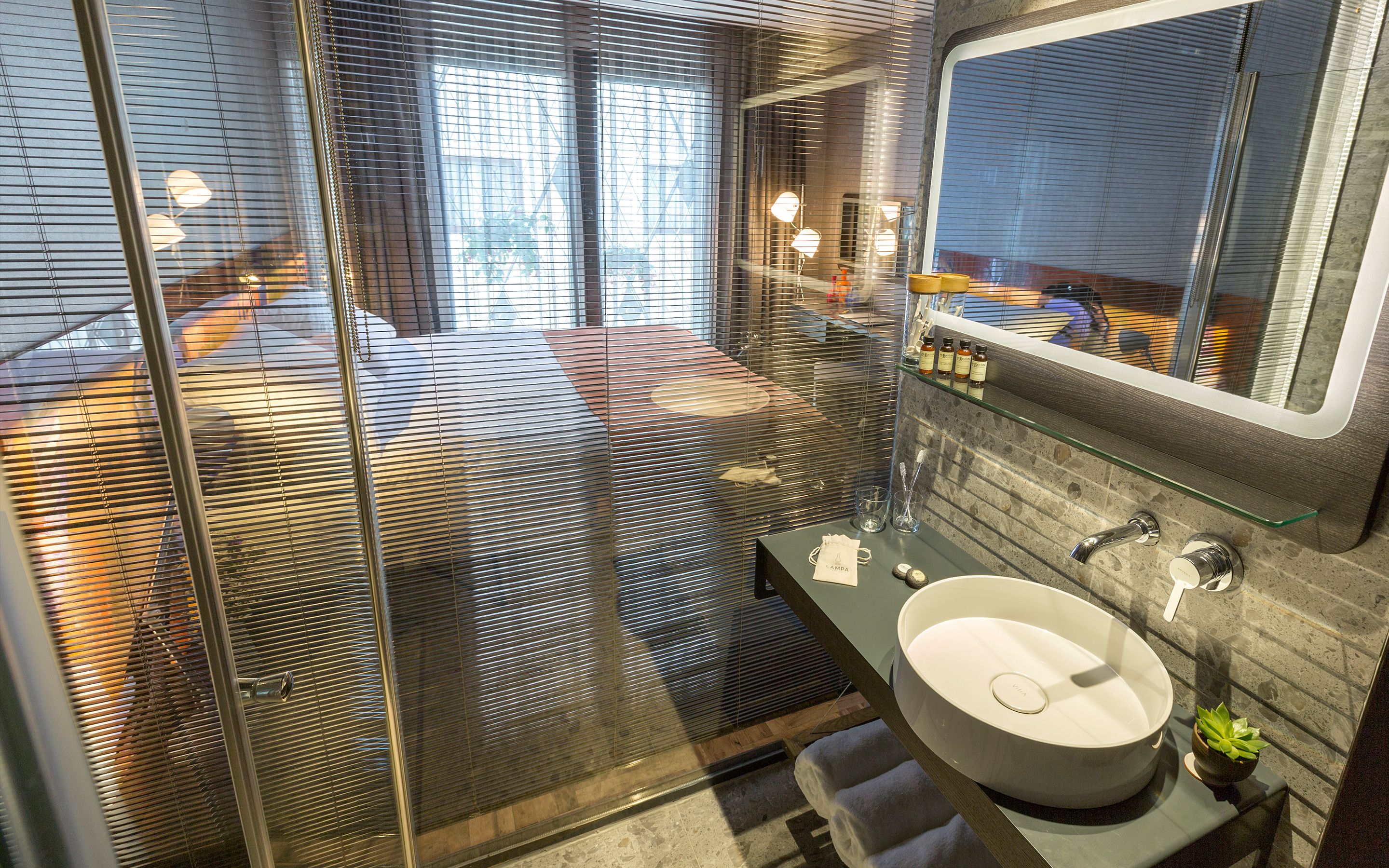 rainfall showerhead, designer toiletries, hair dryer, bathrobes