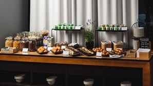 A breakfast buffet with various food items and containers. - Focus Hotel Premium Lublin Conference & SPA (gmina Jastków)