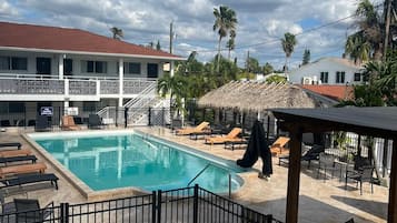Outdoor pool, pool umbrellas, sun loungers