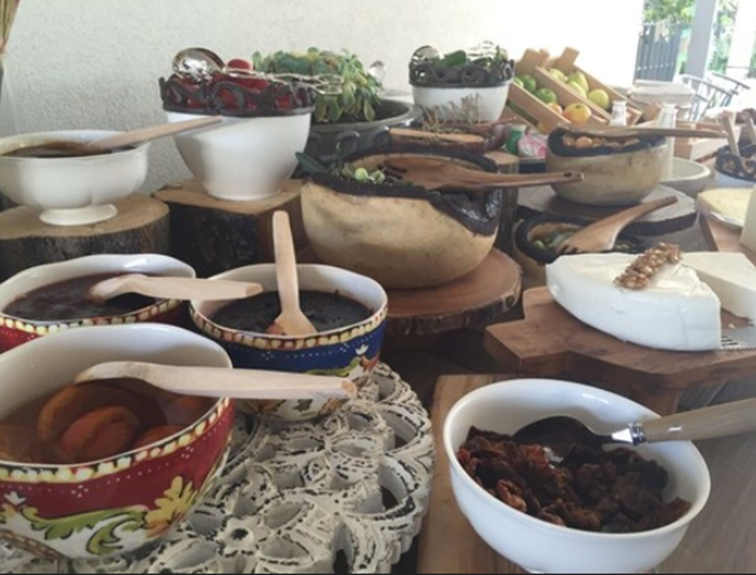 A variety of bowls and containers on a table, likely used for serving food.