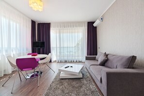 Apartment, 2 Bedrooms, Balcony, Partial Lake View | Living area | Flat-screen TV, pay films - Tomis Garden Aparthotel (Constanta)