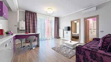 Apartment, 1 Bedroom | Living room | Flat-screen TV, pay movies