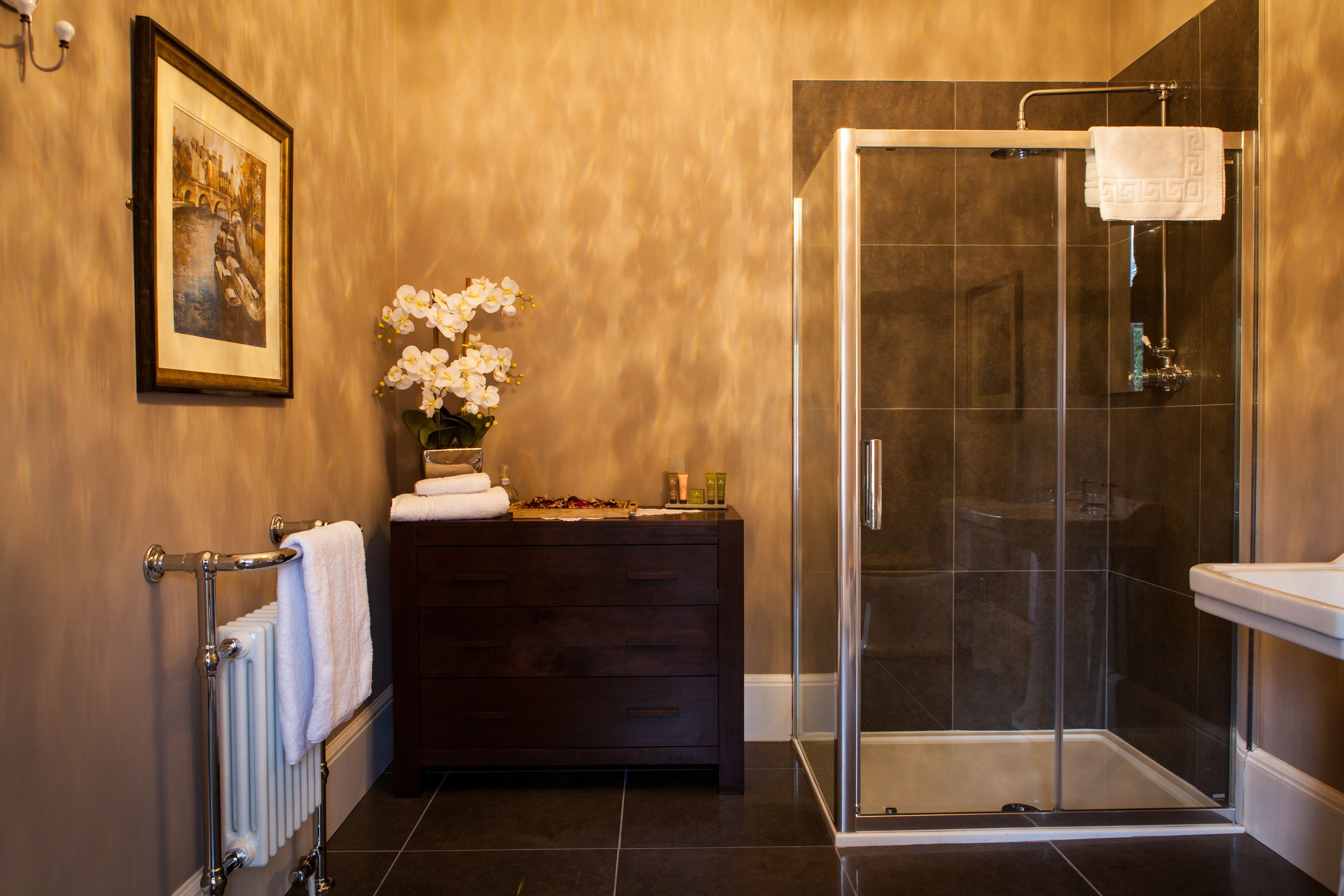 executive suite | bathroom | shower, free toiletries, hair dryer, slippers