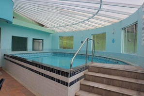 Indoor pool, outdoor pool, pool umbrellas, pool loungers