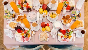 A breakfast buffet with various food items, beverages, and condiments. - Marnas Hotels (Istanbul)